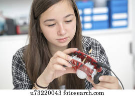 Female electronics student in laboratory