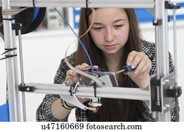 Female electronics student in laboratory