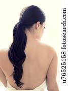 Woman with long brown hair in pony tail