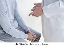 Male doctor with patient