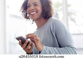 Mid adult woman using phone