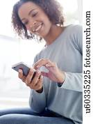 Mid adult woman using phone