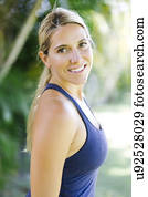 Blonde woman in tank top smiling