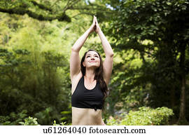 Caribbean Islands, Saint Lucia, woman doing yoga exercises in open air