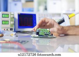 Assembling electronics device.