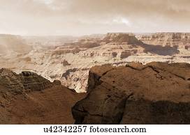 Illustration of the Valles Marineris canyon system on Mars as the Sun sets. The Valles Marineris is over 4000 kilometres (km) long, up to 200 km wide and up to 7 km deep, dwarfing the Grand Canyon of Arizona, USA. The canyons are found on the...