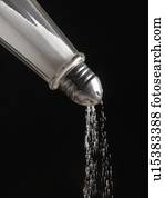 Salt pouring from salt cellar.