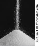 Salt pouring into a pile.