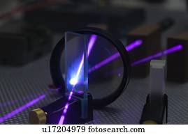Laser experiment in photonics laboratory.