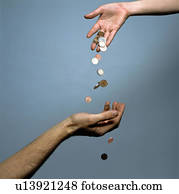 Hands dropping coins