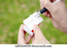 Hand of a woman taking the memo Hand of a woman taking the memo