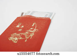 Close-up of paper currency in an envelope