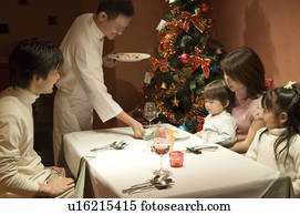 Adult African American family having Christmas dinner Stock Image