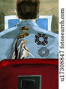 Man at desk with computer connections on his back