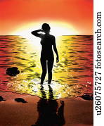 Woman on beach at sunset