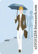 Portrait of a businesswoman holding an umbrella and walking