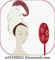 Close-up of a young woman holding a mirror