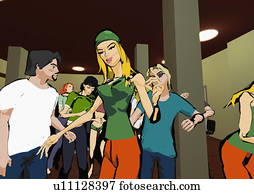 Young trendy people dancing in a nightclub