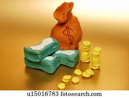 A bag of money with bills and coins next to it