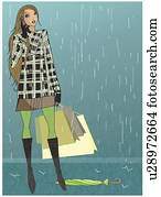 Woman caught in the rain with her shopping bags talking on the mobile phone