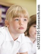 Student in class paying attention (selective focus)