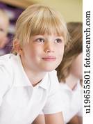 Student in class paying attention (selective focus)