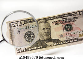 Money under a magnifying glass