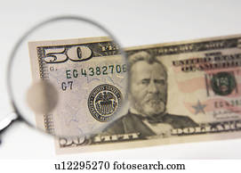 Money under a magnifying glass