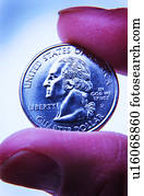 Hand holding quarter