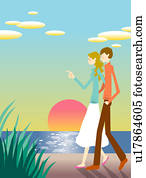 Young couple walking by beach at sunset Young couple walking by beach at sunset