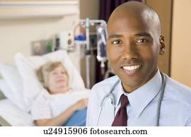 Doctor Smiling,Standing In Hospital Room