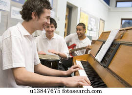 Student musicians practising in classroom