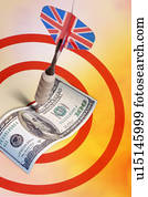 A dart shooting a paper money on the dartboard