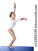 Girl practicing gymnastic pose, side view Stock Photo | u10584497 ...