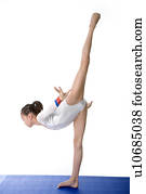 Girl practicing gymnastic pose, side view Stock Photo | u10584497 ...