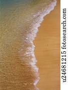 Gentle Waves Lapping at the Sandy Beach, High Angle View