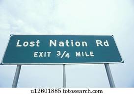 A sign that reads “Lost Nation Rd - Exit 3/4 mile”