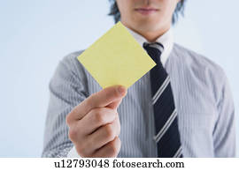 Businessman holding memo Businessman holding memo