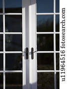Exterior Shot of White French Doors with Black Handles