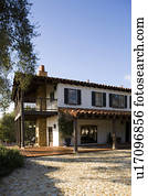 Exterior of Spanish Style Home and Landscape