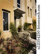Exterior Shot of Contemporary Yellow Stucco Condominiums/Homes