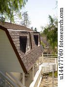 Exterior Shot of Traditional Home with Red Trim