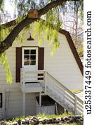 Exterior shot of traditional home with red trim