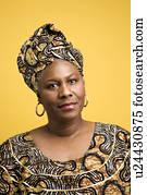 African American mature adult female dressed in African costume. African American mature adult female dressed in African costume.