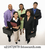 Portrait of multi-ethnic business group standing holding briefcases and looking at viewer.