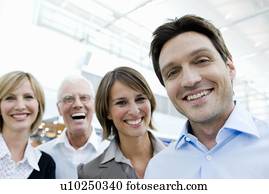 4 happy people looking at viewer 4 happy people looking at viewer