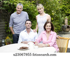 Family afternoon in summertime garden