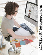 Female designer working at her computer