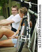 Couple relaxing after bike ride
