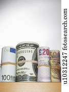 Rolls of currency on shelf